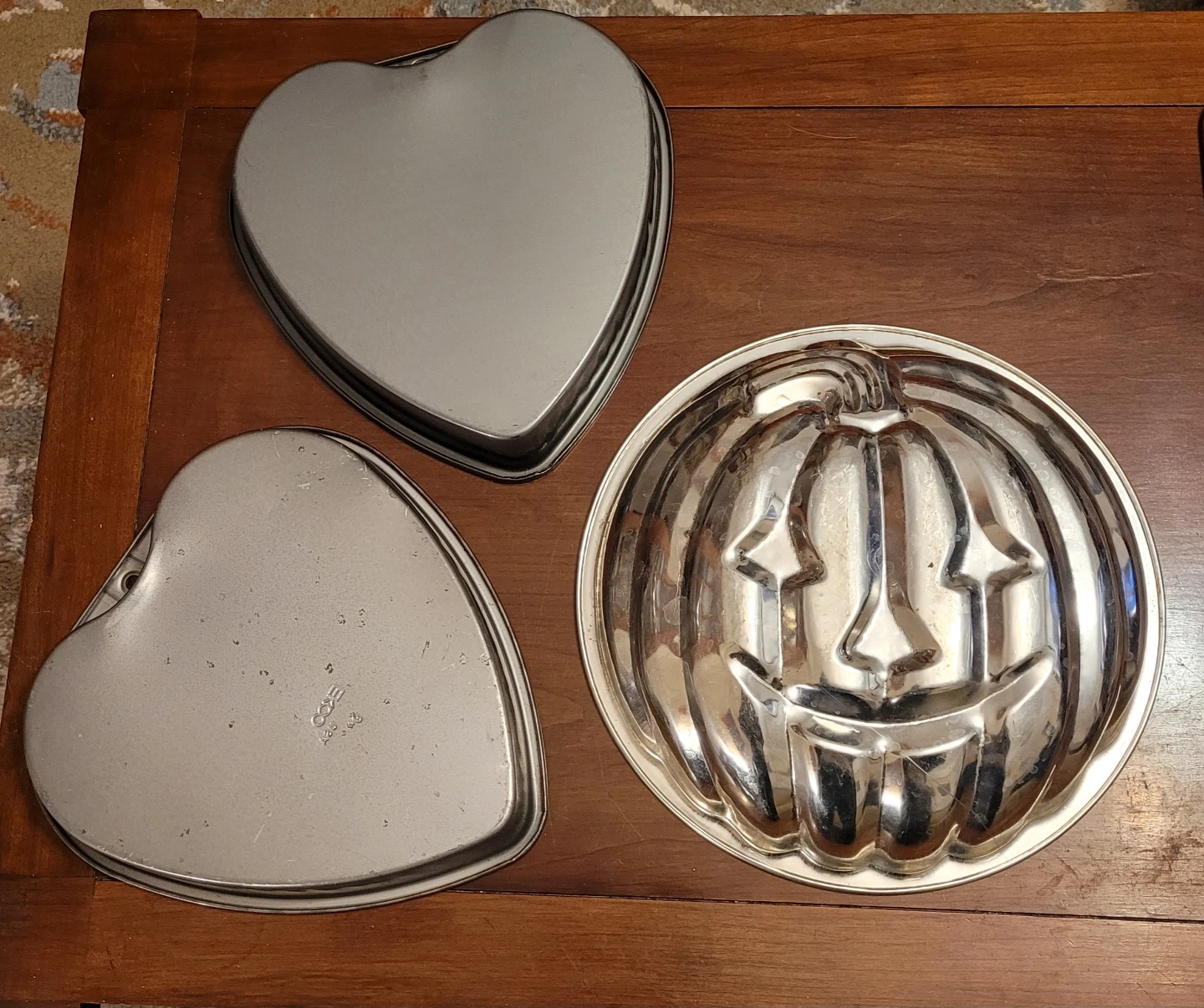 Pumpkin shaped cake pan & two Ekco Heart shaped pans