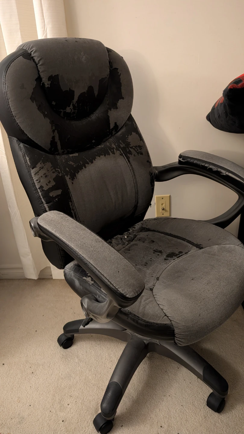 Well-worn black office chair