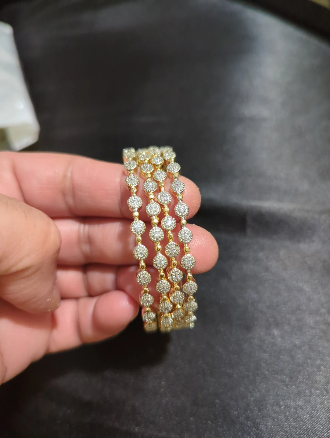 Set of four gold-tone bangles