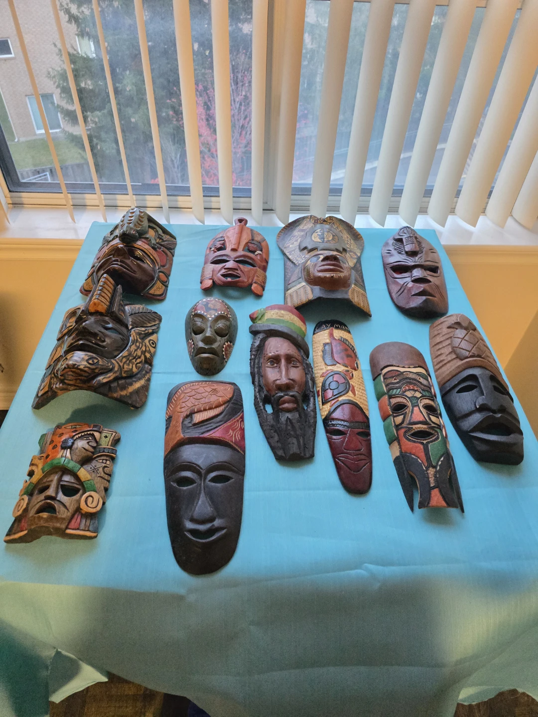 Collection of12 hand carved wood masks