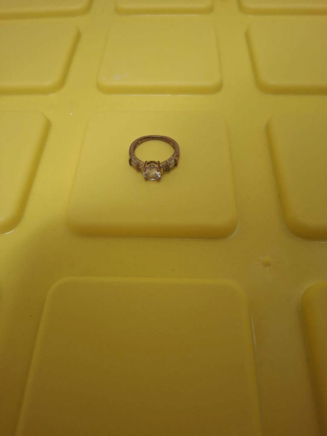 Gold-tone accent ring with clear stones