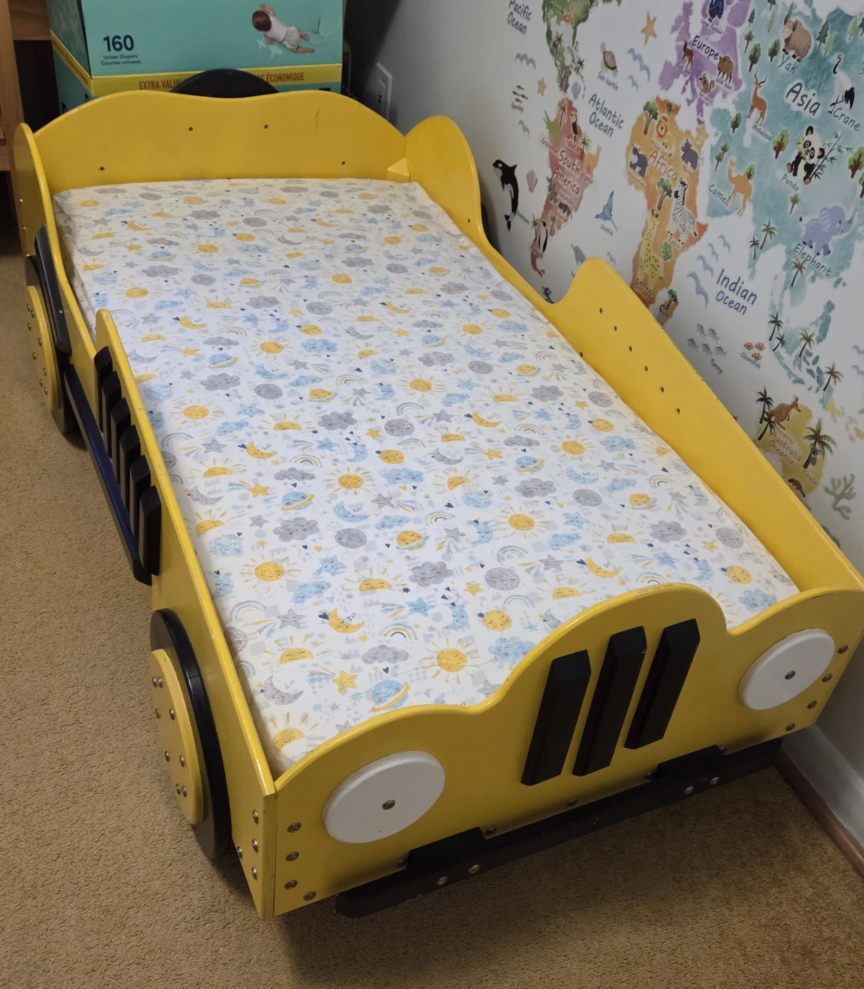 Yellow car-shaped toddler bed