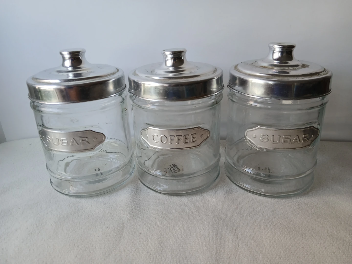 Three Glass Canisters with Metal Lids. ALL 3 for $8.