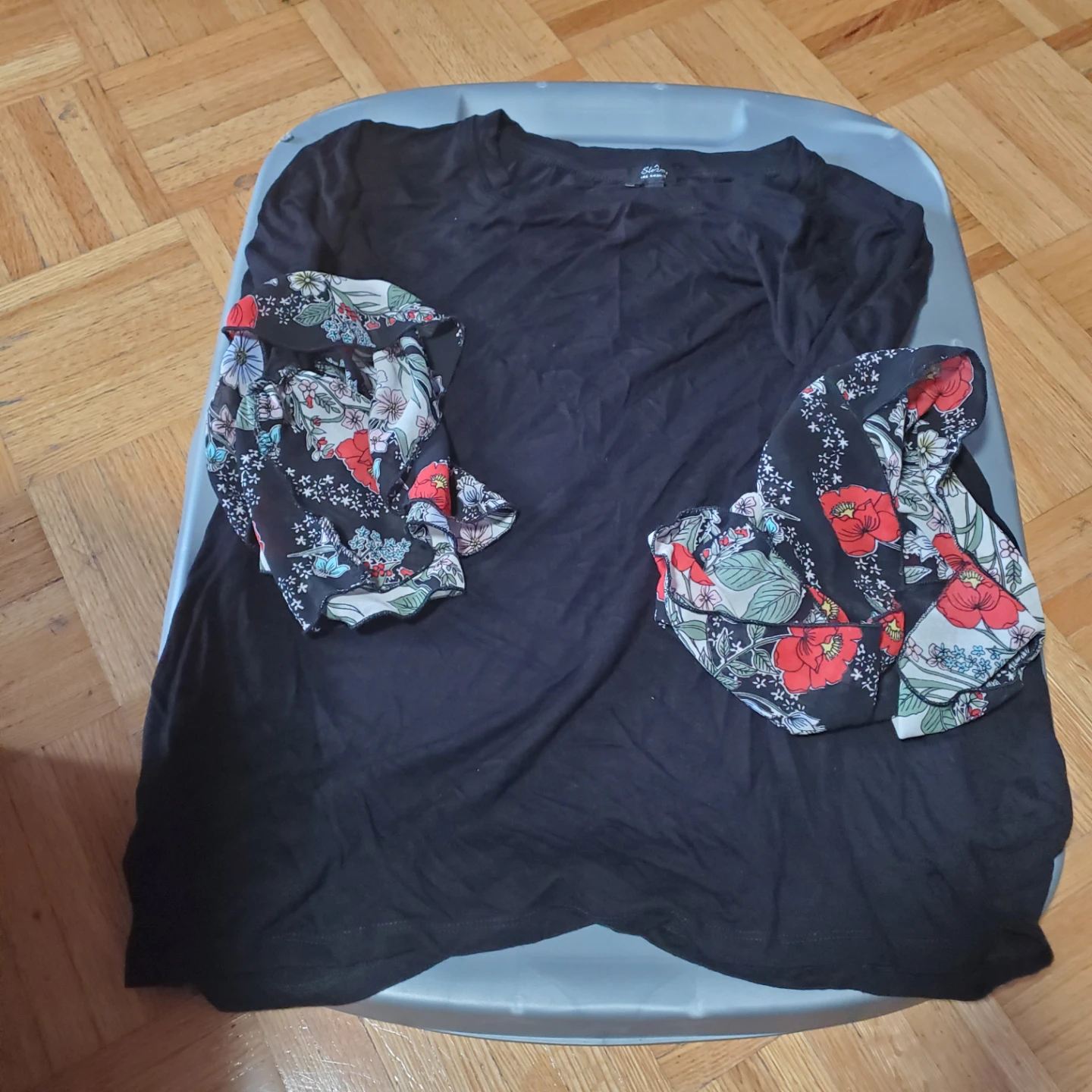 Black blouse with floral bell sleeves