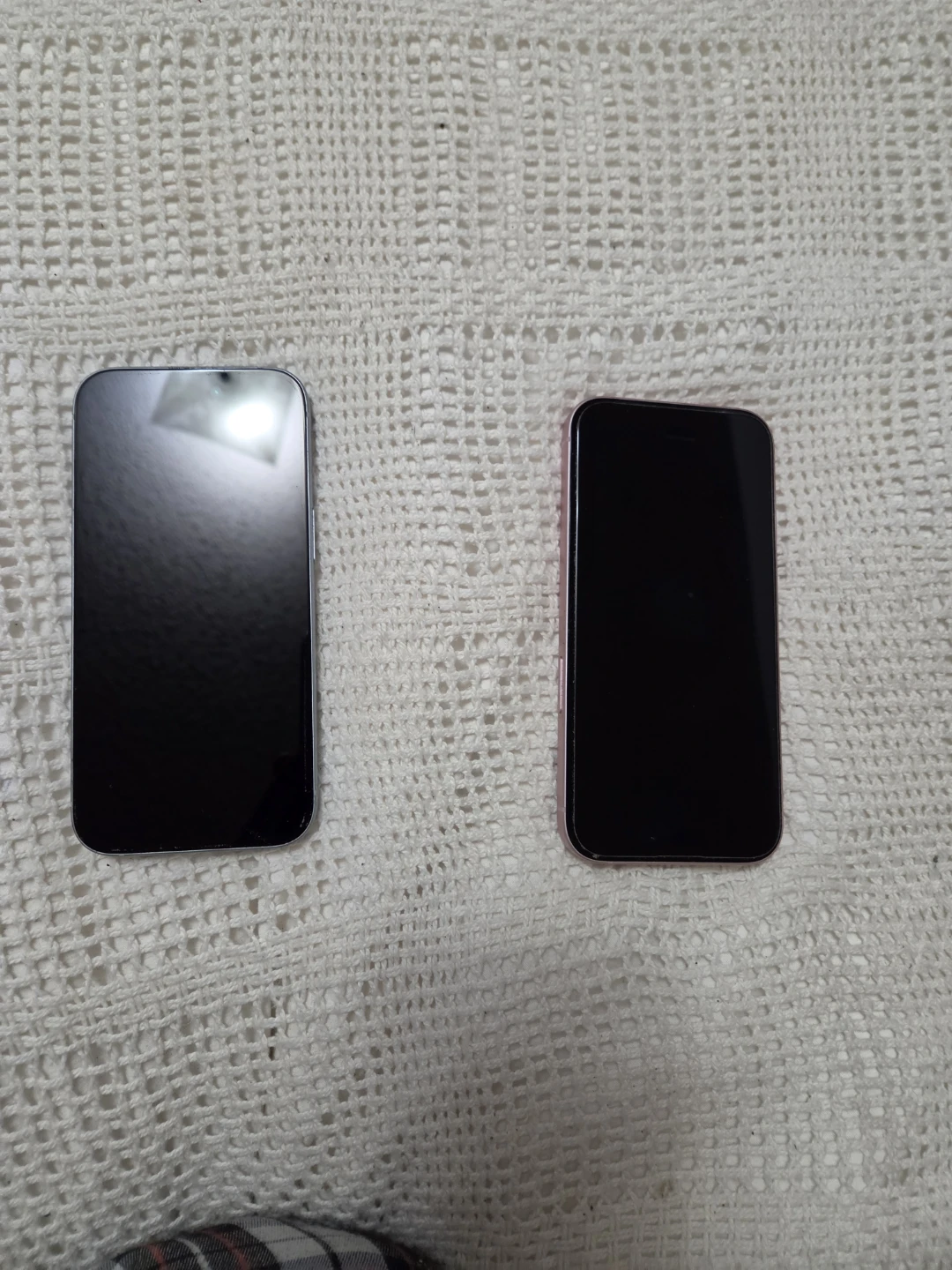 Two Apple iPhone 15's