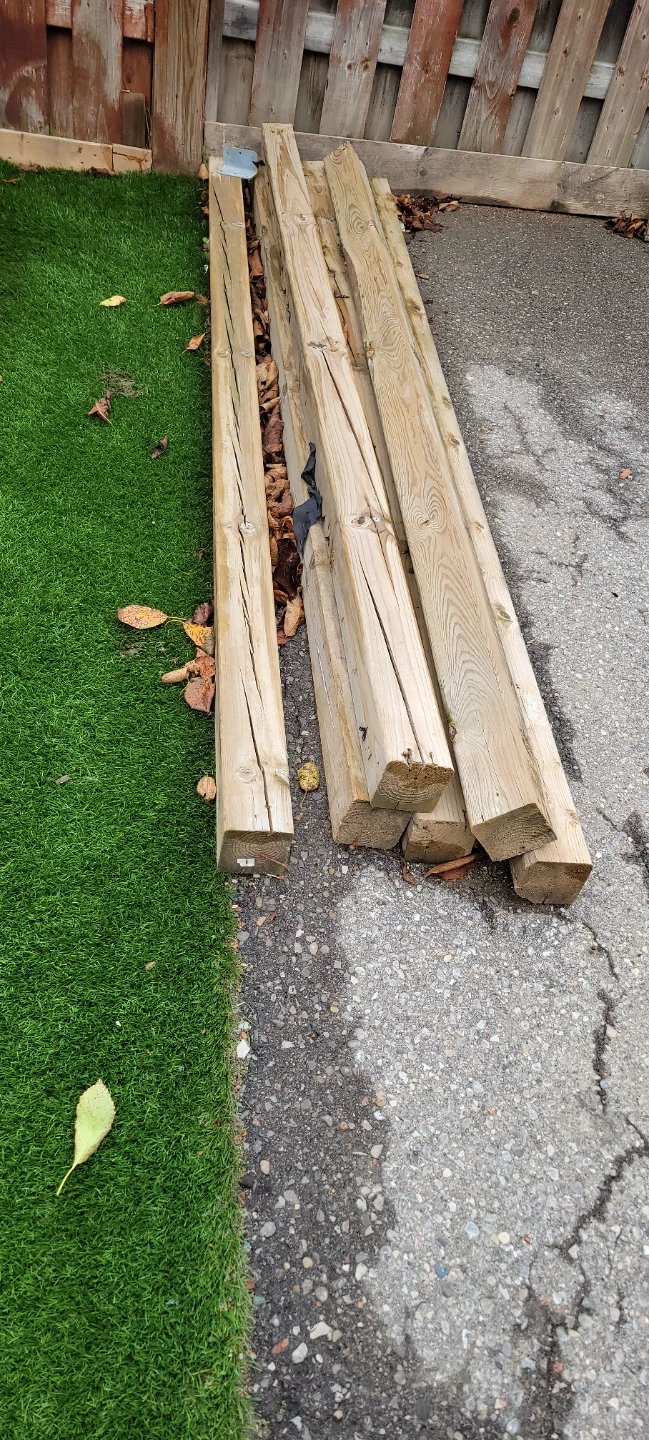 Assorted Pressure-Treated Wood Posts