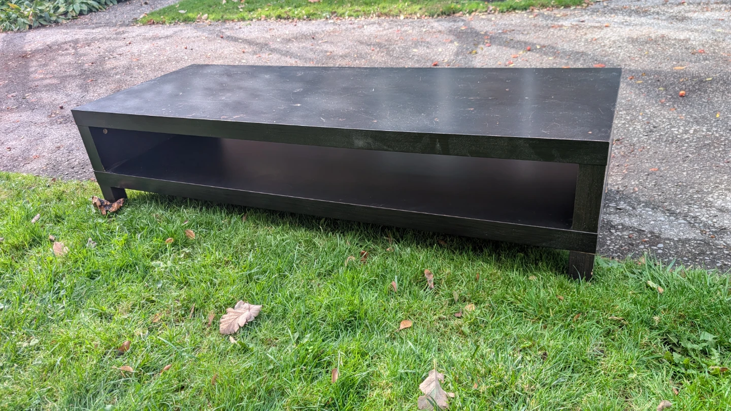 Black Ikea coffee table with open storage