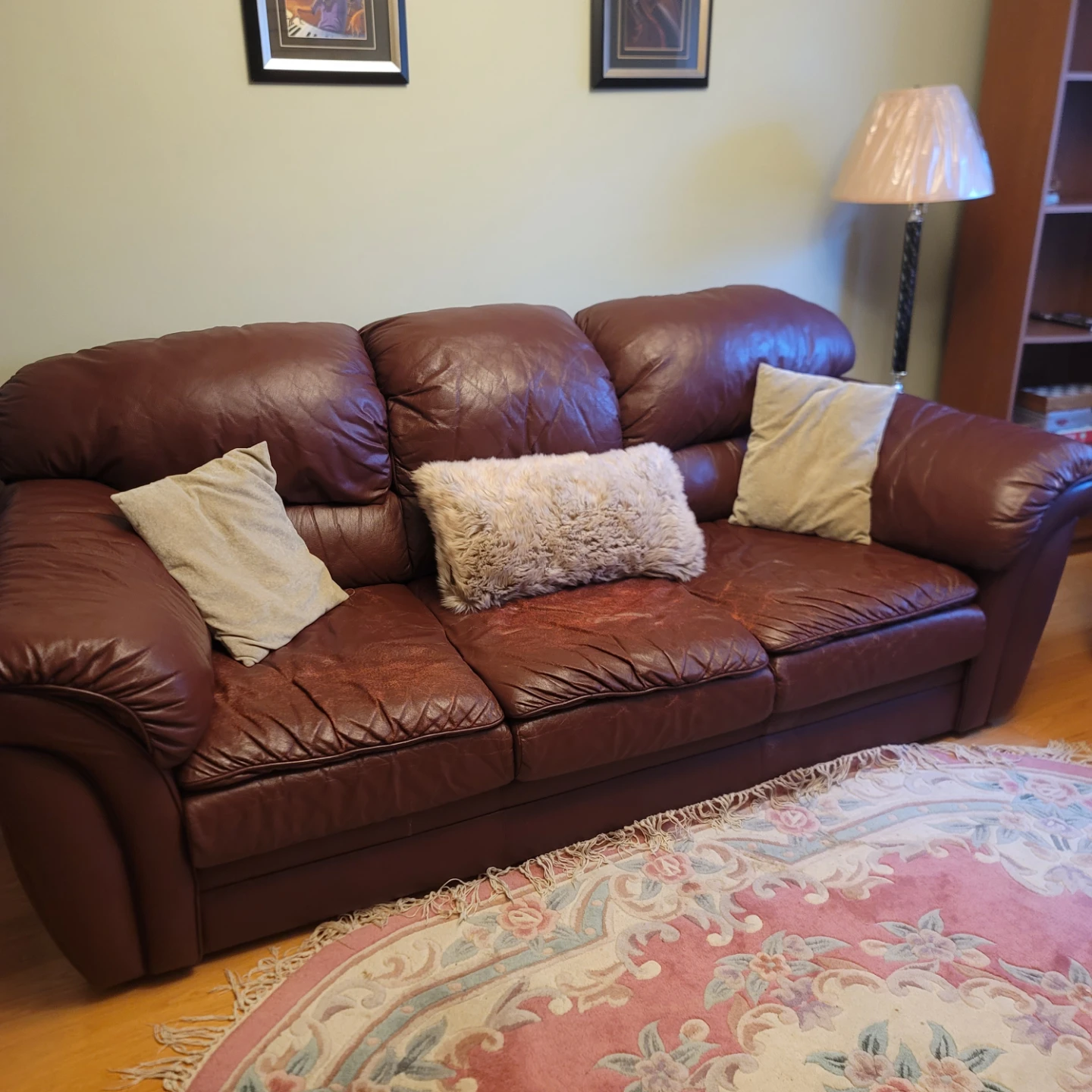Two Burgundy Leather Sofas
