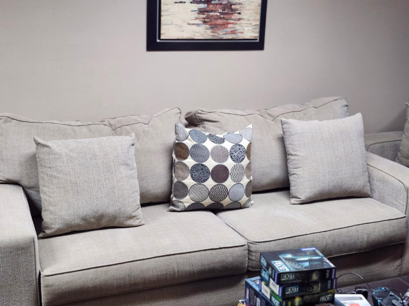 cream sofa and love seat with accent cushions - photo 2