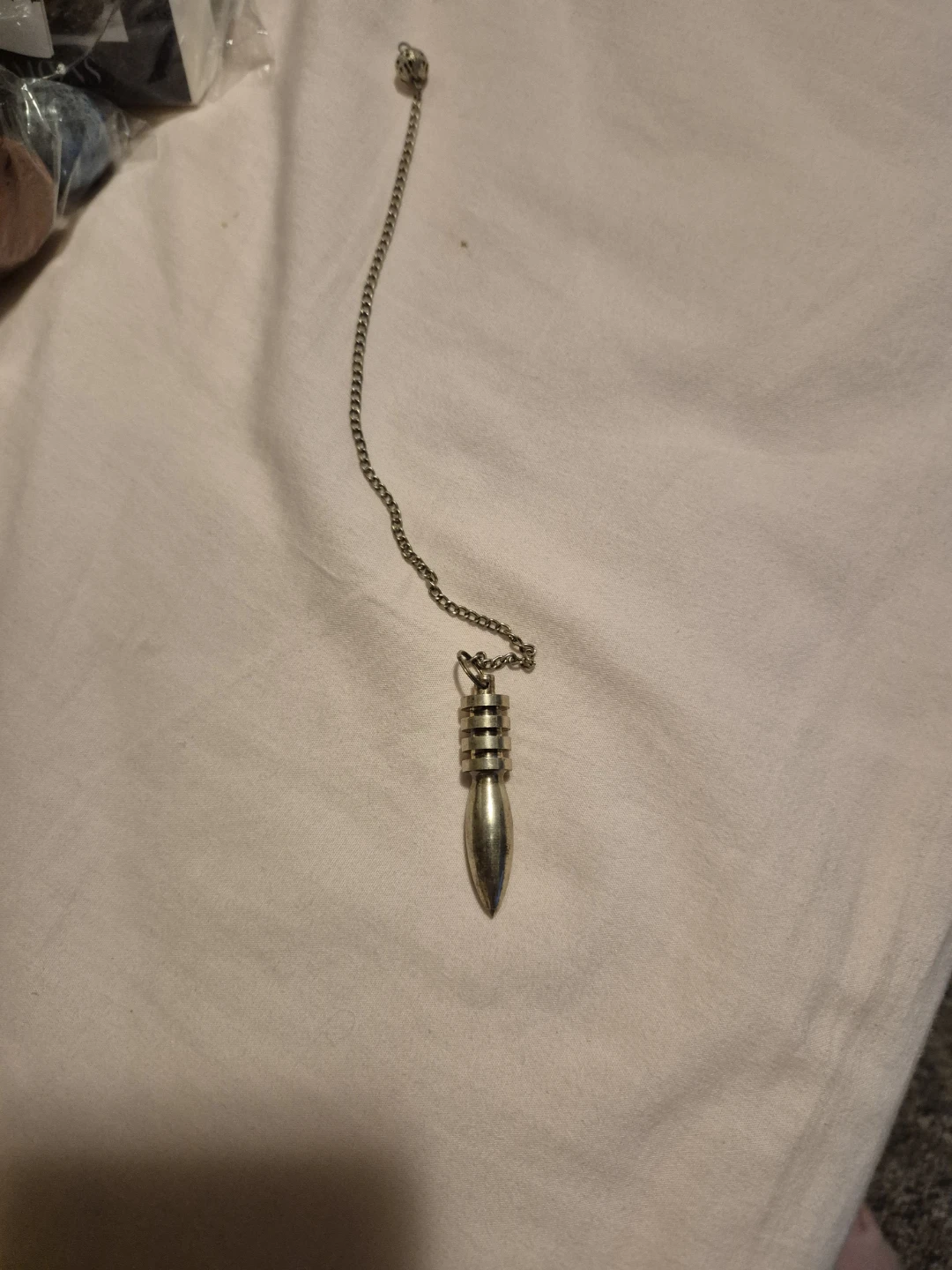 Crystals, crystal book and pendulum