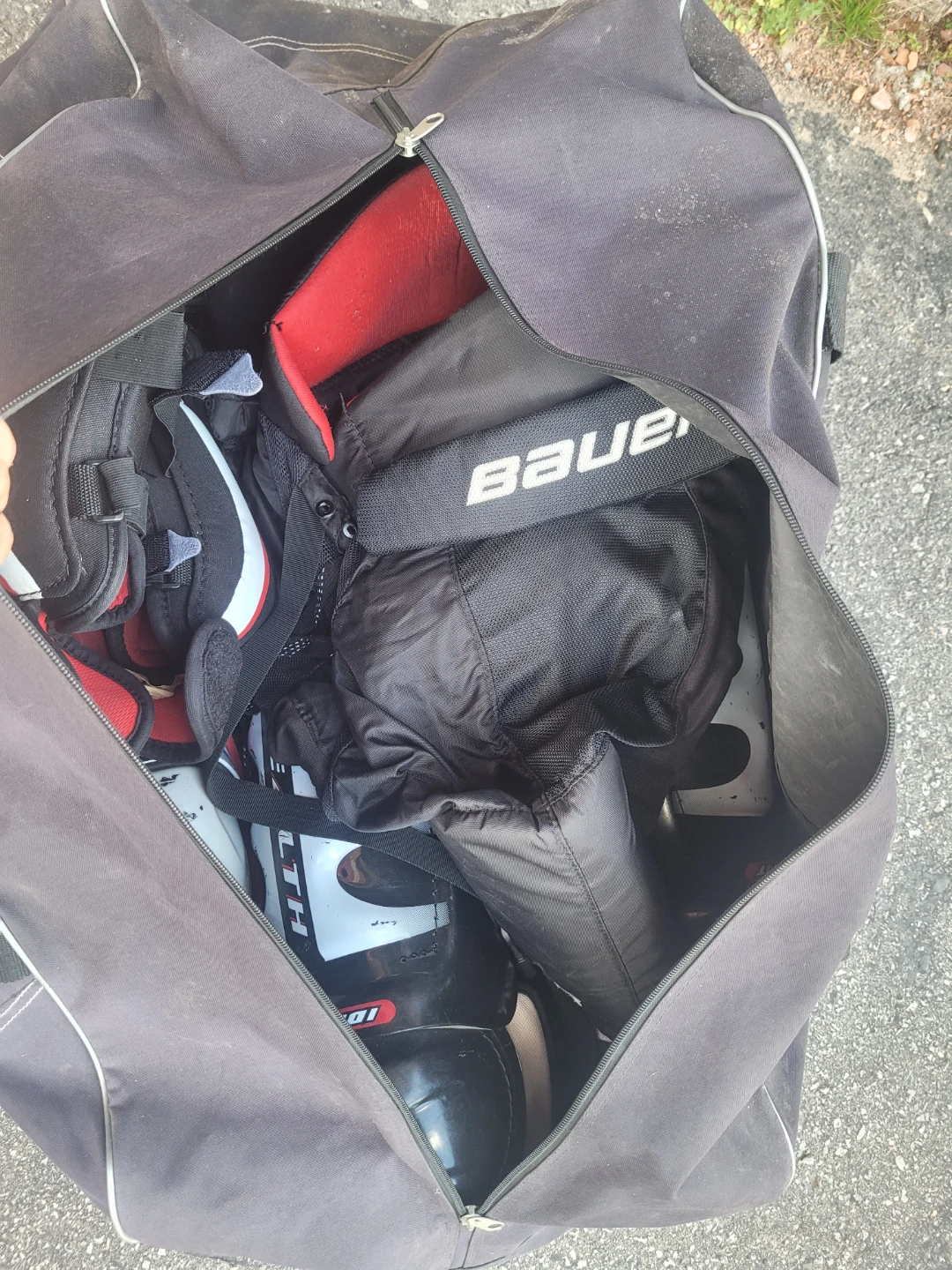 Men's bag full of hockey gear