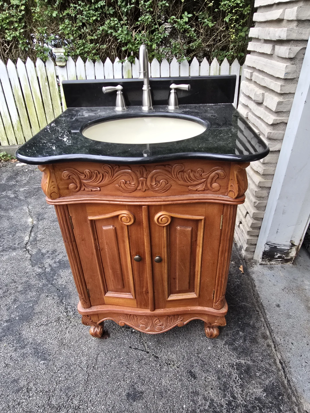 Traditional Wood Bathroom Vanity with Black Granite Countertop