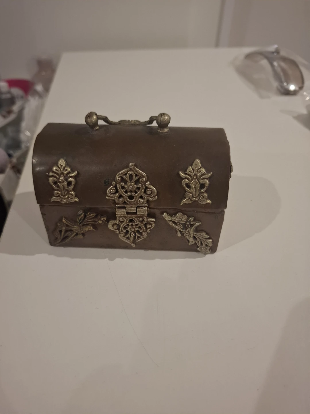 Small decorative metal treasure chest box