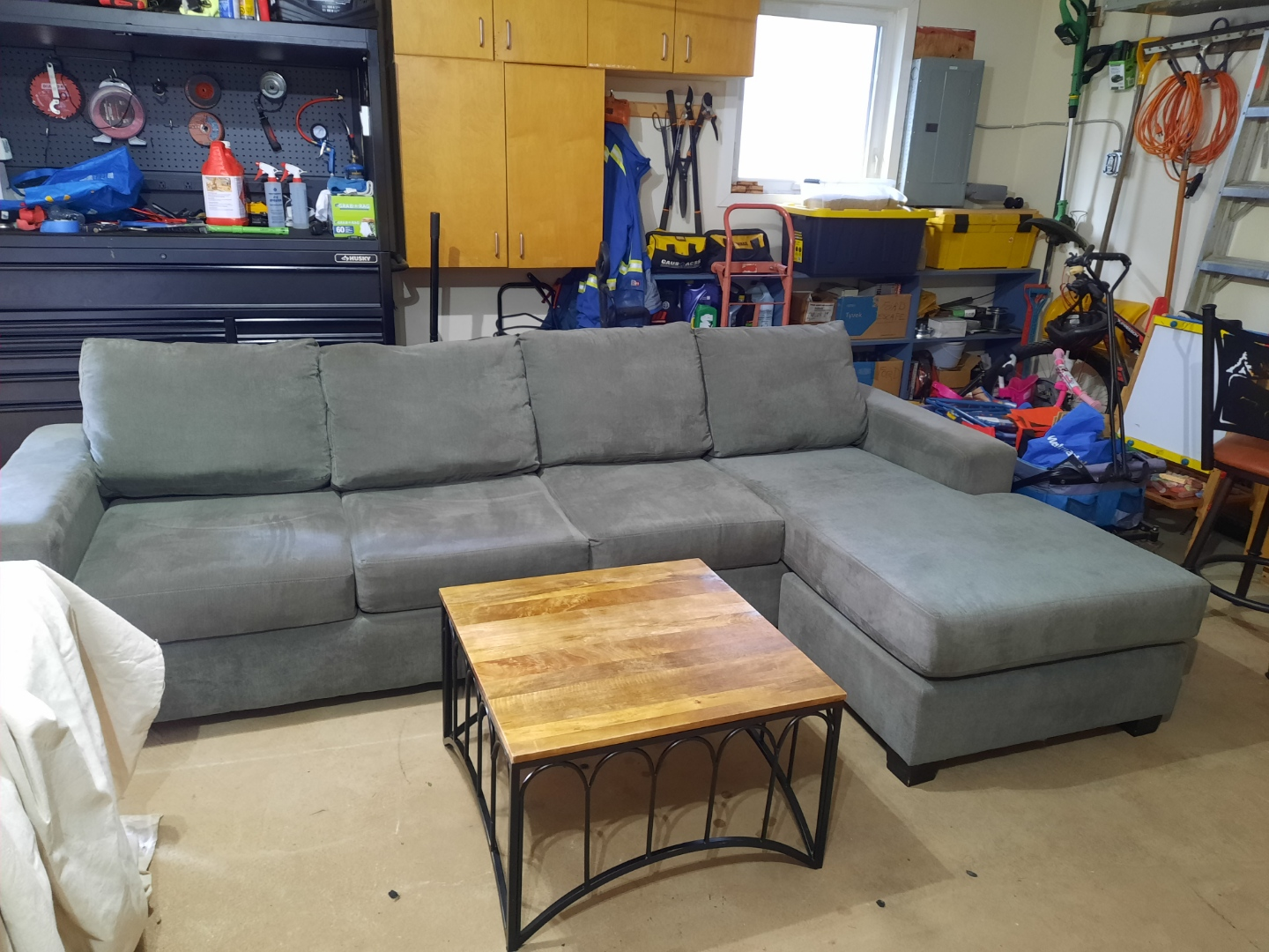 Grey sectional sofa with ottoman and coffee table