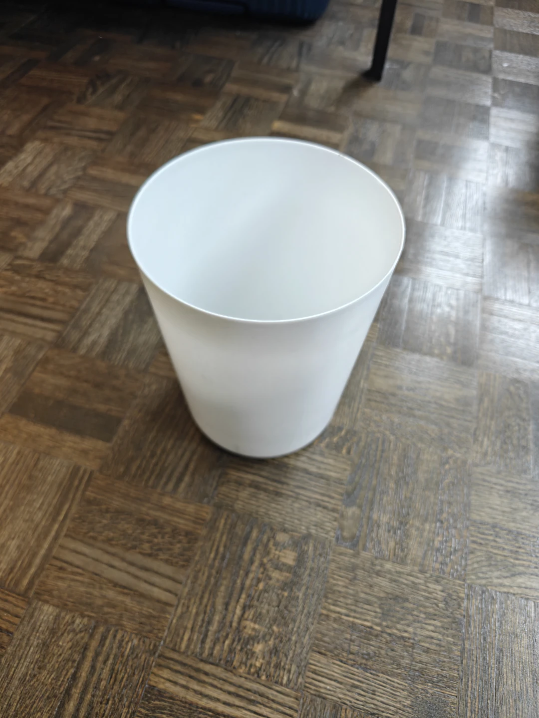 White plastic waste bin