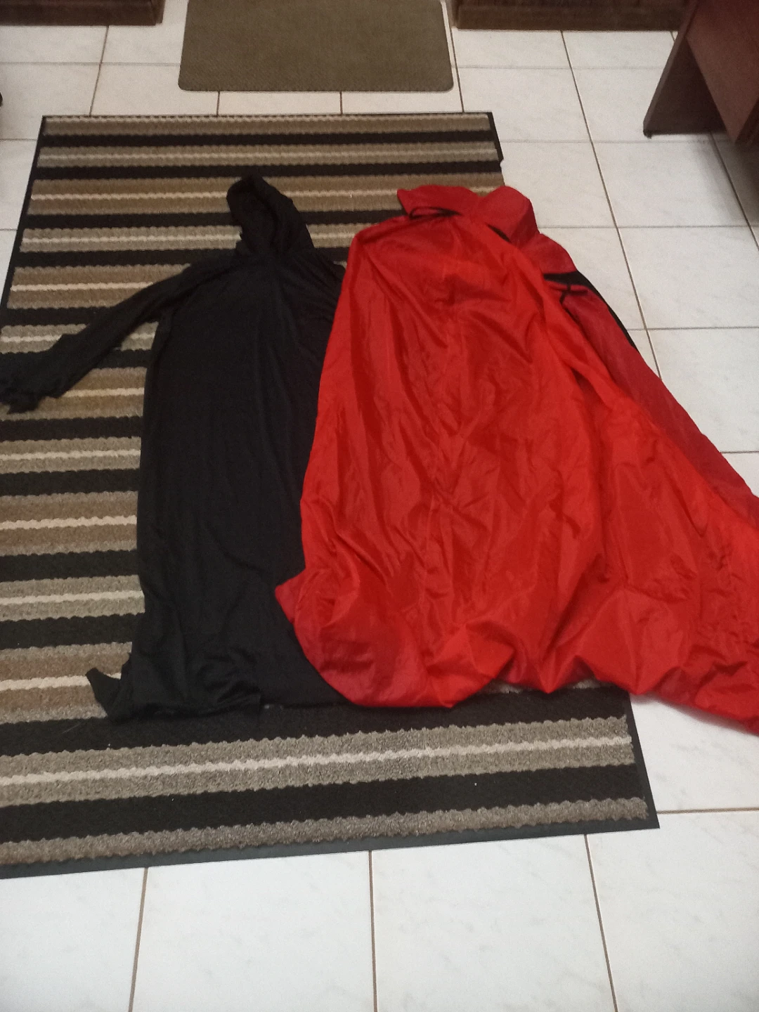 Two Halloween Costumes - Black and Red and one cape