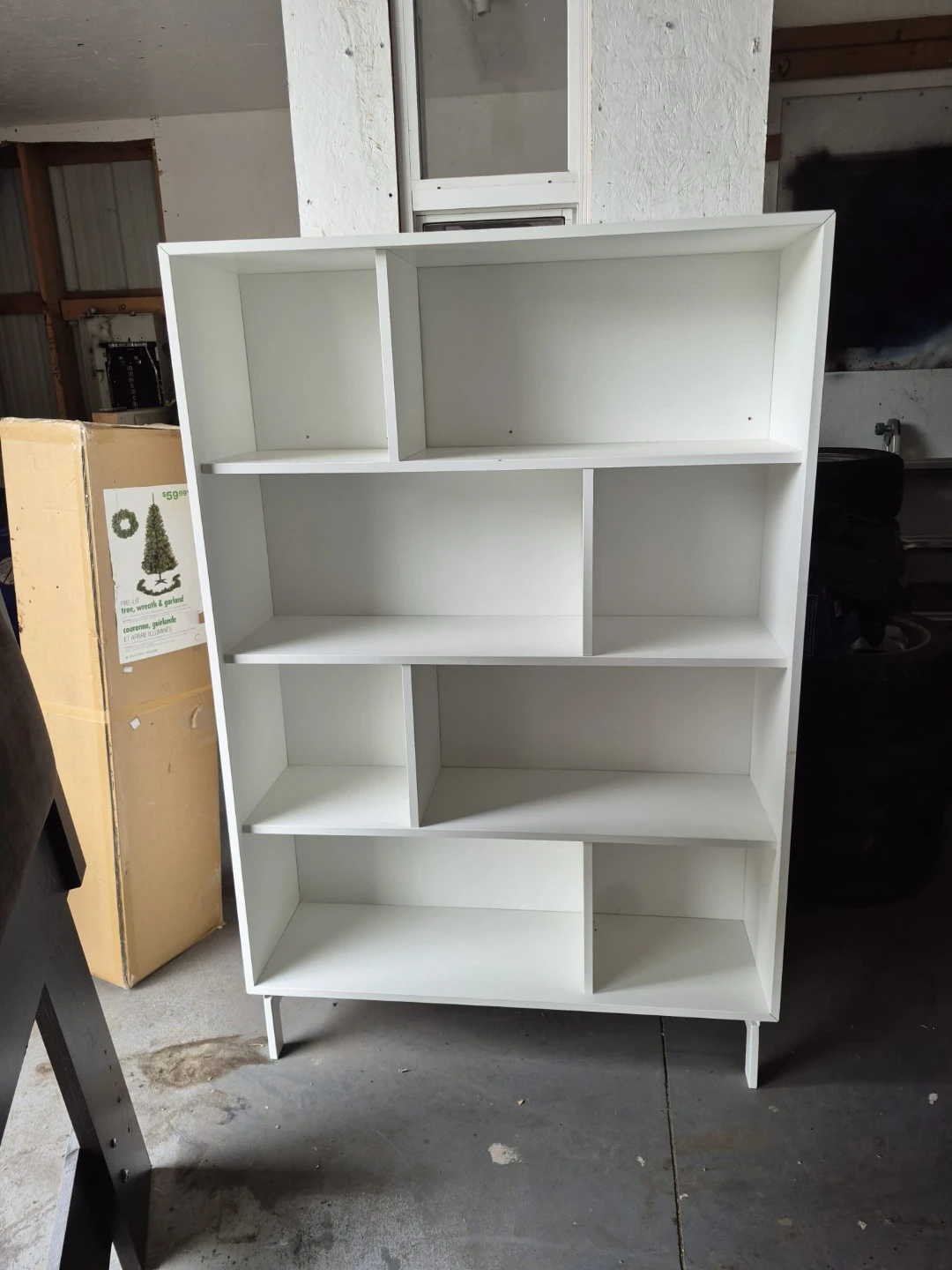 White modern bookshelf with staggered shelving