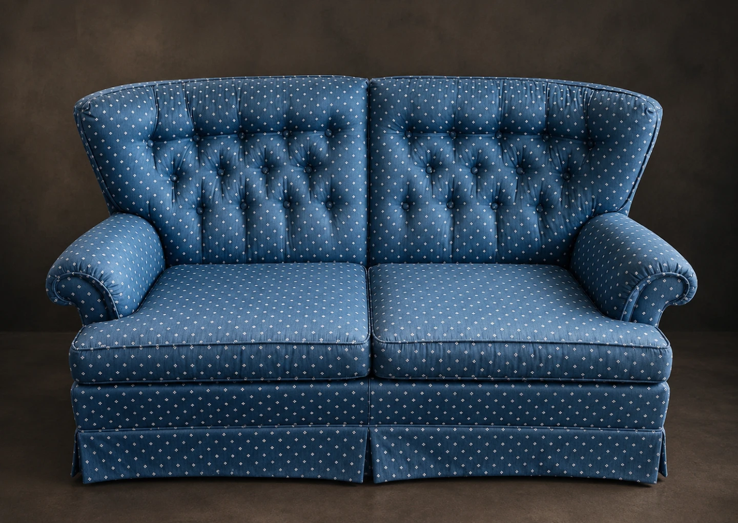 Blue patterned tufted loveseat