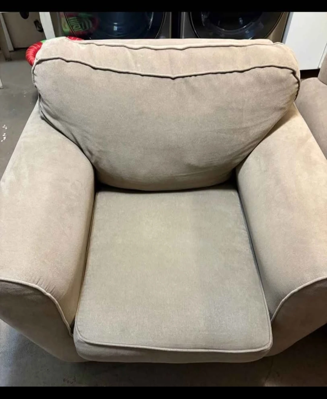 Two beige upholstered armchairs