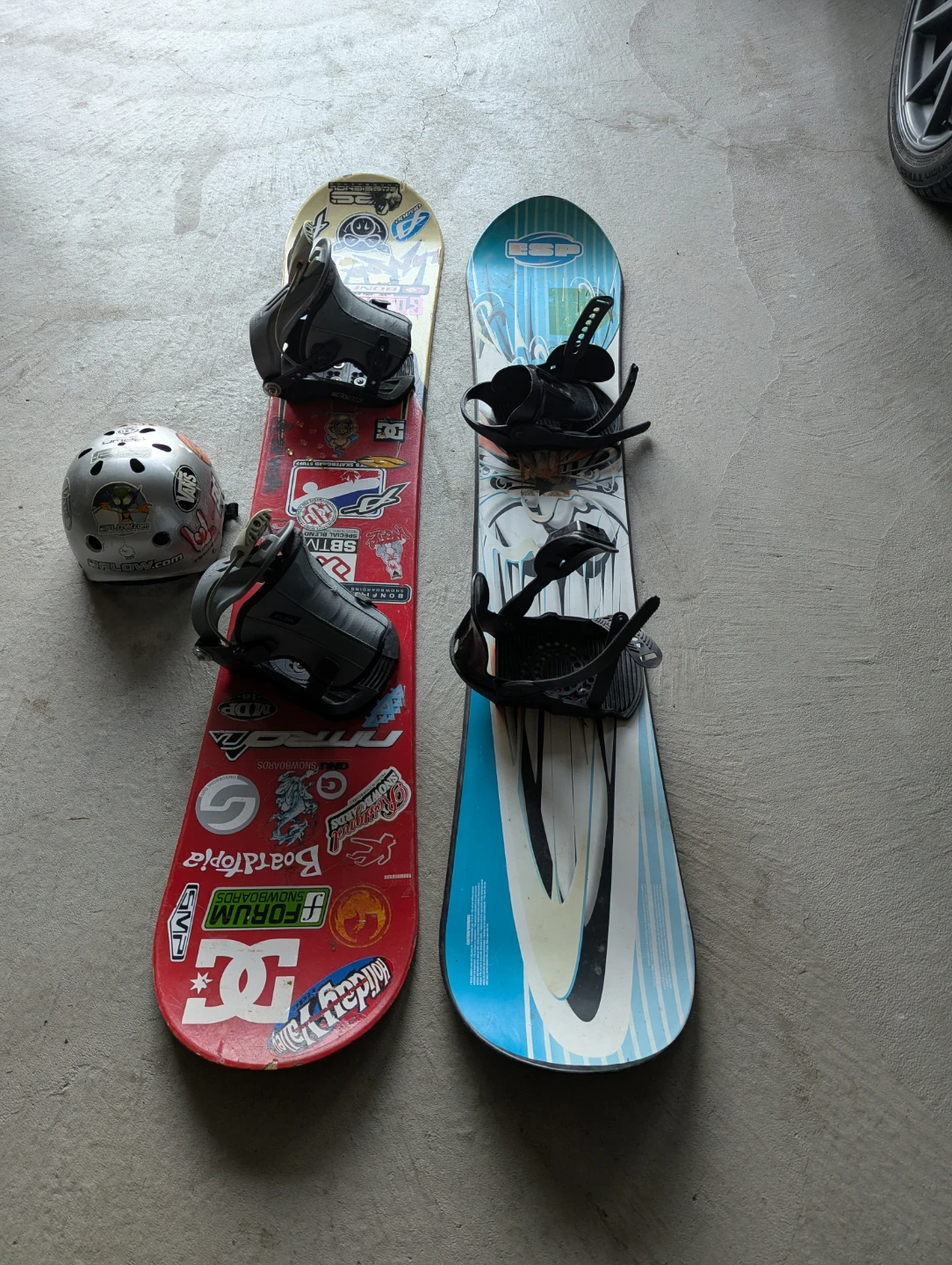 Two Snowboards with Bindings and Helmet