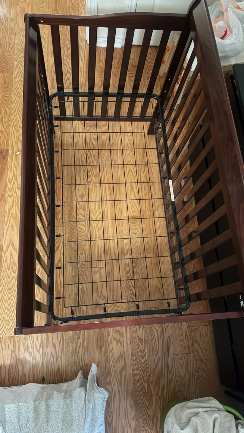 Dark wood baby crib with mattress (rarely used)