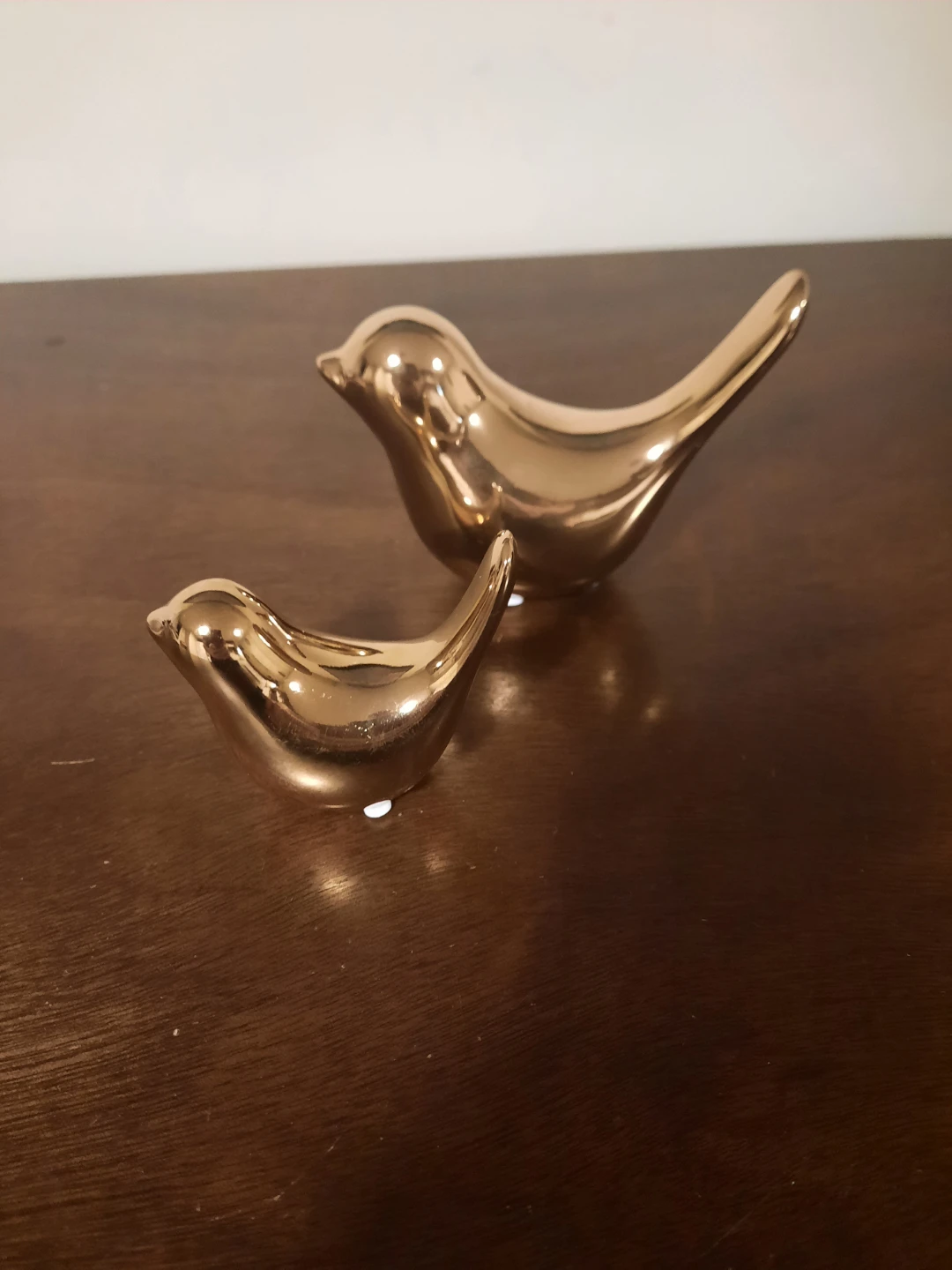 Set of two gold ceramic bird figurines