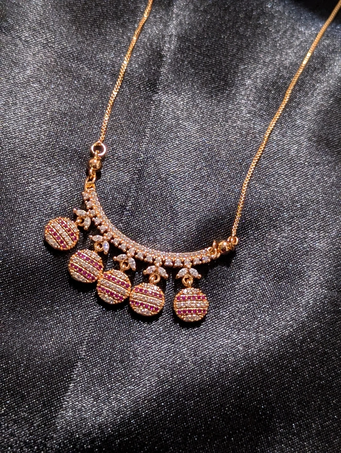 Gold-tone necklace with ruby-style stones