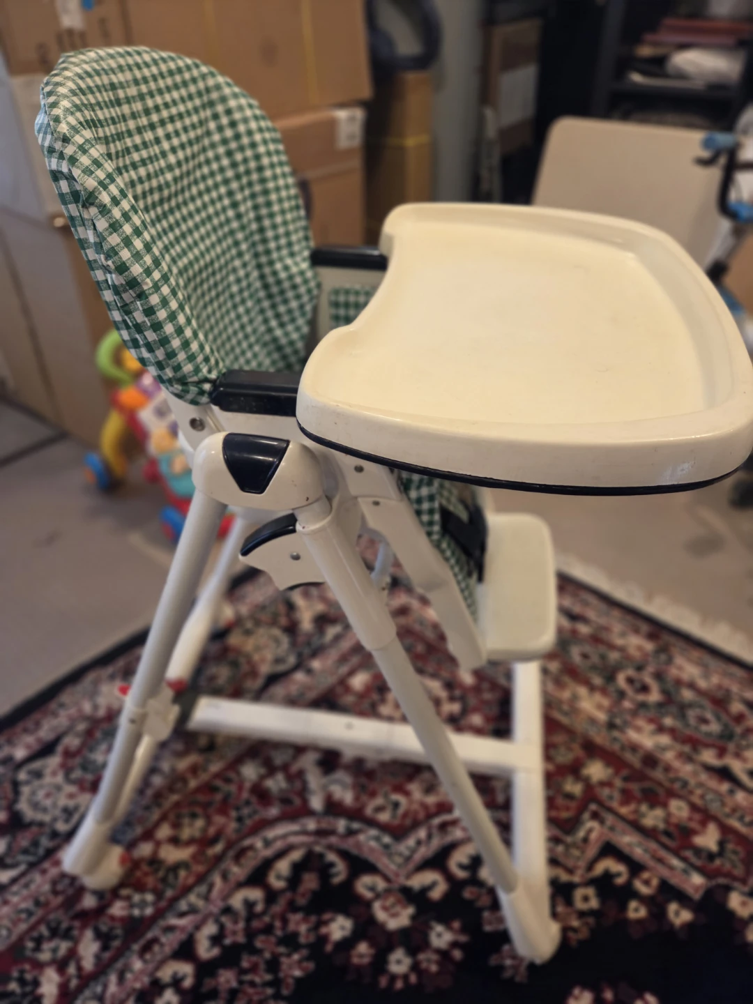 Peg Perego high chair with green checkered seat