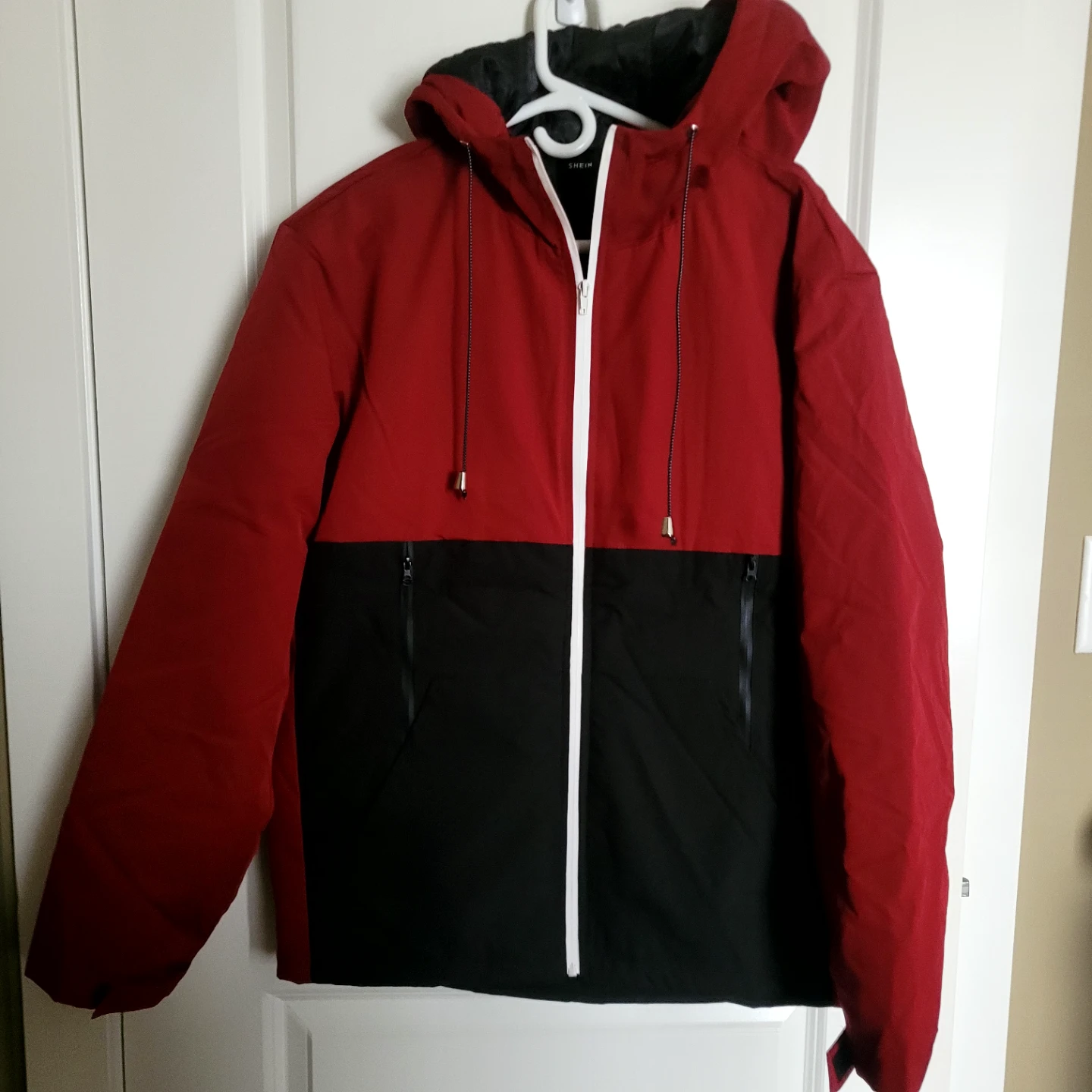 Red and Black Hooded Jacket. Wind break