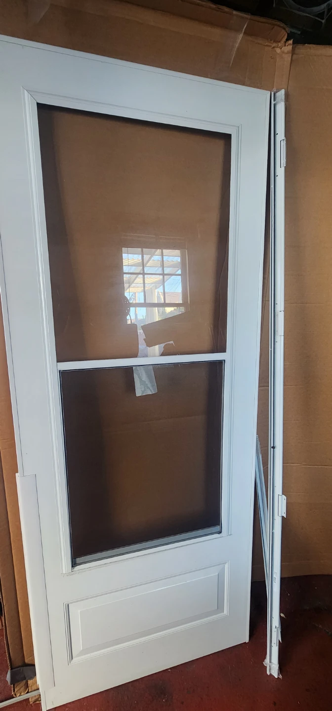 Storm Door 32"x80" NEW IN BOX, Self-storing glass - photo 2