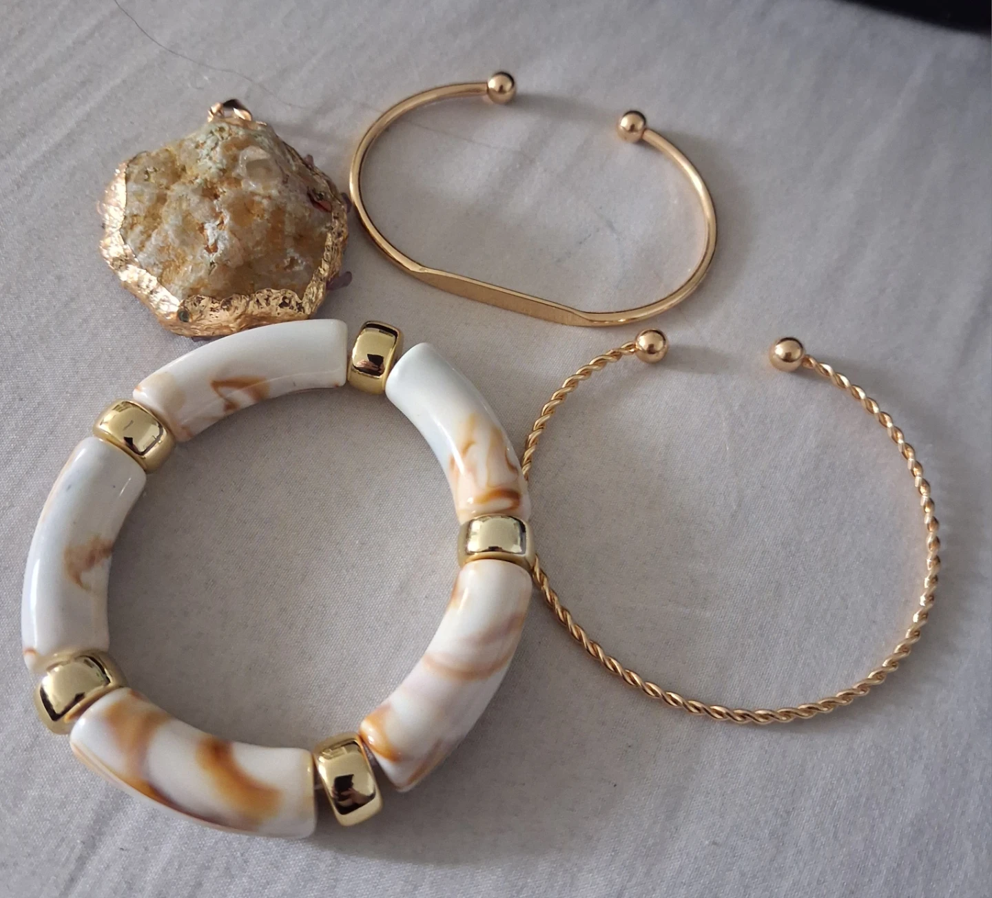 Set of 3 gold-tone bracelets and pendant