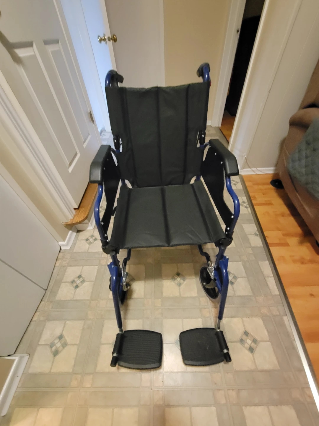 Blue folding transport wheelchair
