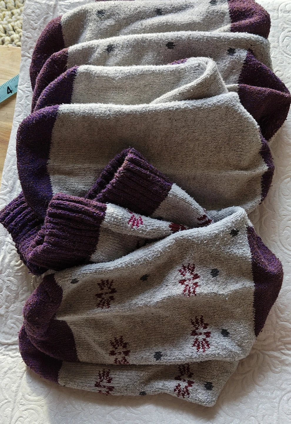 3️⃣ Three pairs of cozy winter themed socks