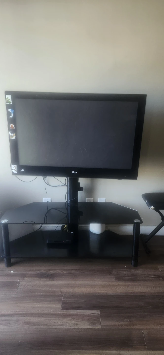 Black Glass TV Stand for sale and the TV is free!
