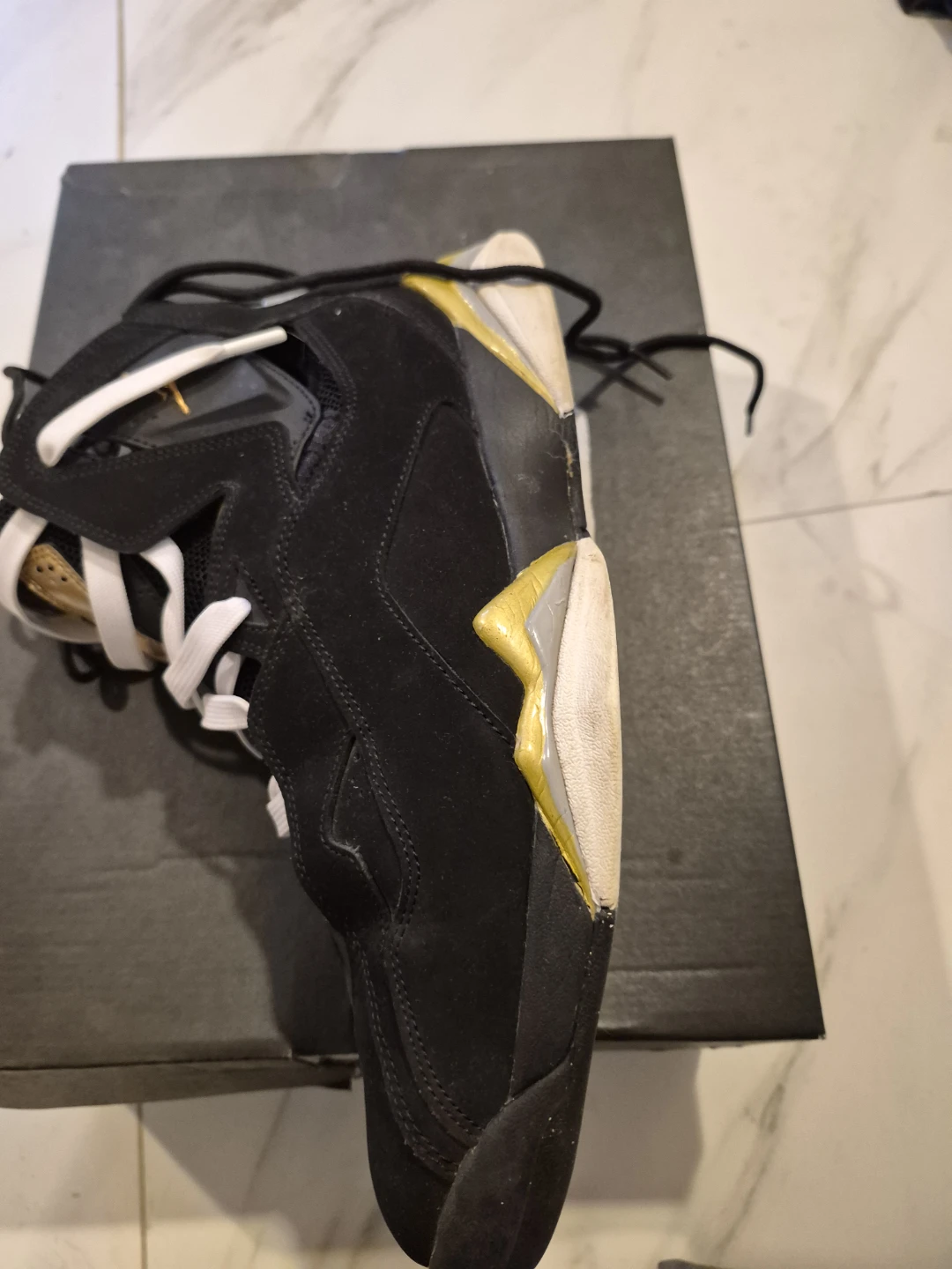 Air Jordan 7 Black and Gold Sneakers - photo 2