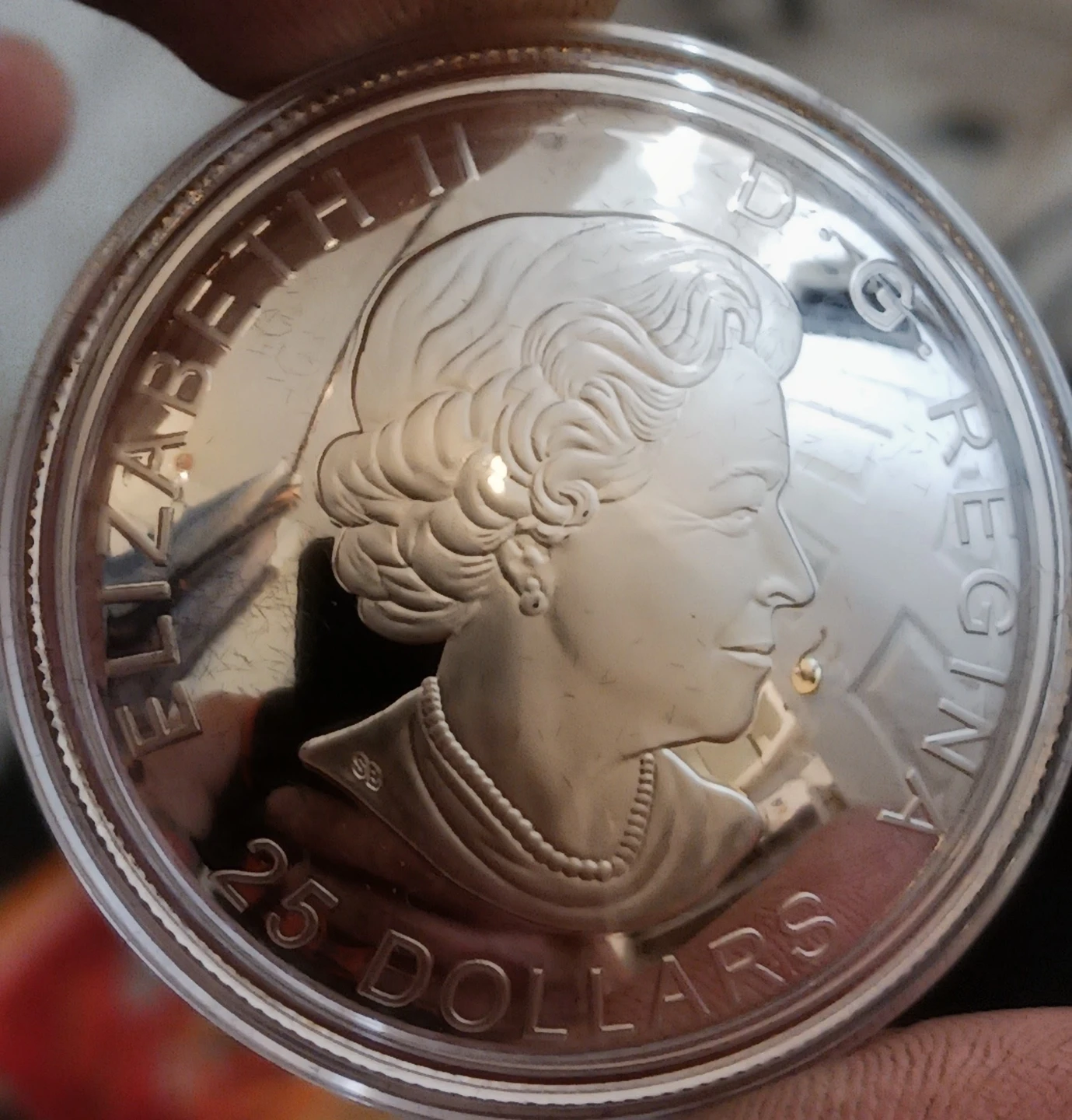 2021 1 ounce .999 25$ silver Coin 24k Gold inlay - photo 2