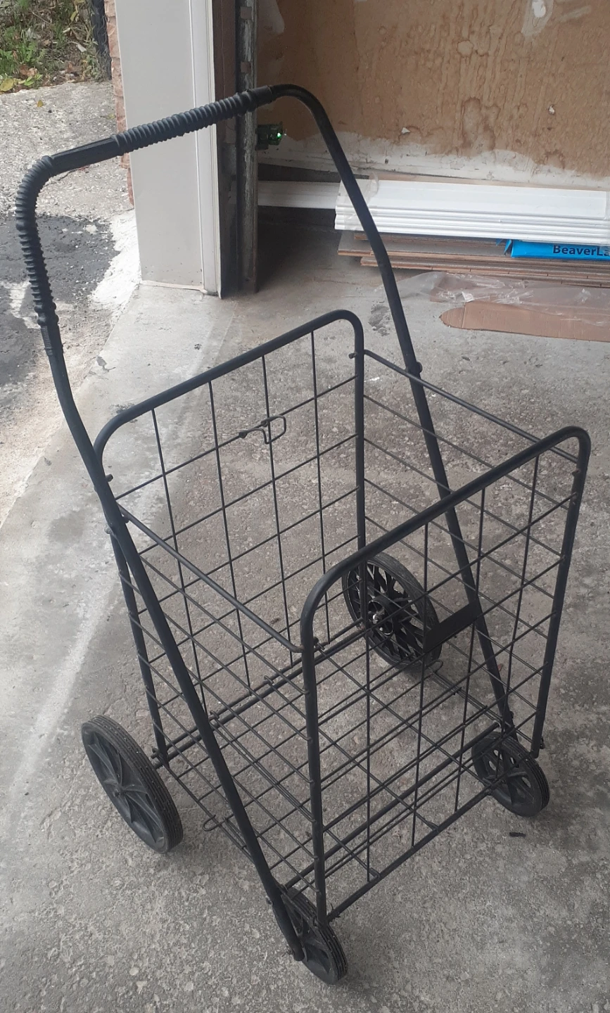 Black Metal Shopping Utility Cart with four working wheels.
