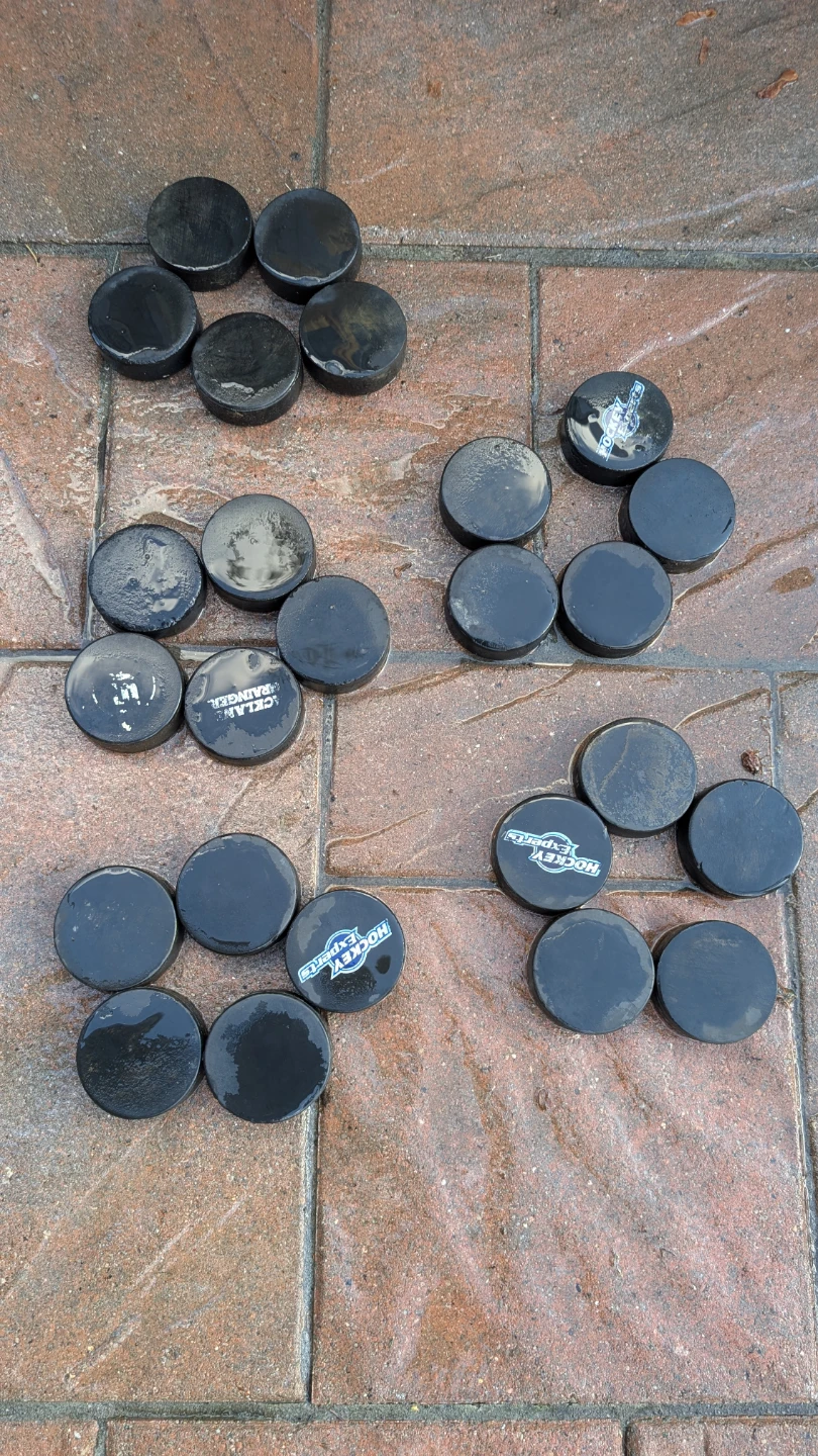 25 Assorted Black Hockey Pucks