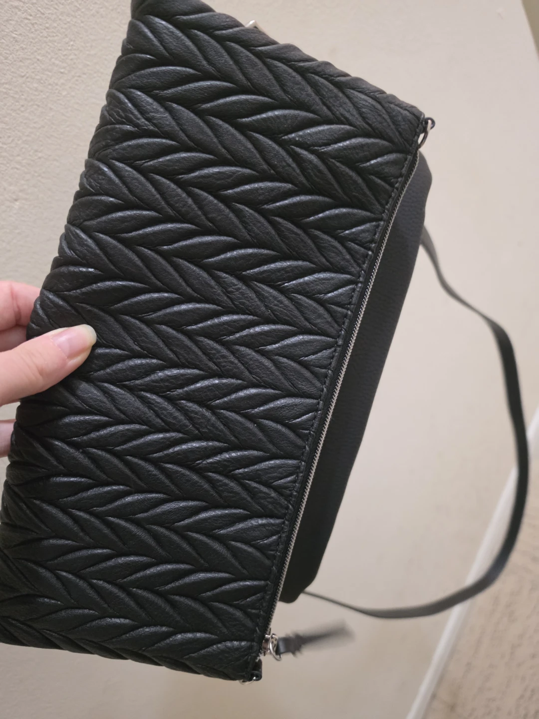 Black woven leather crossbody bag