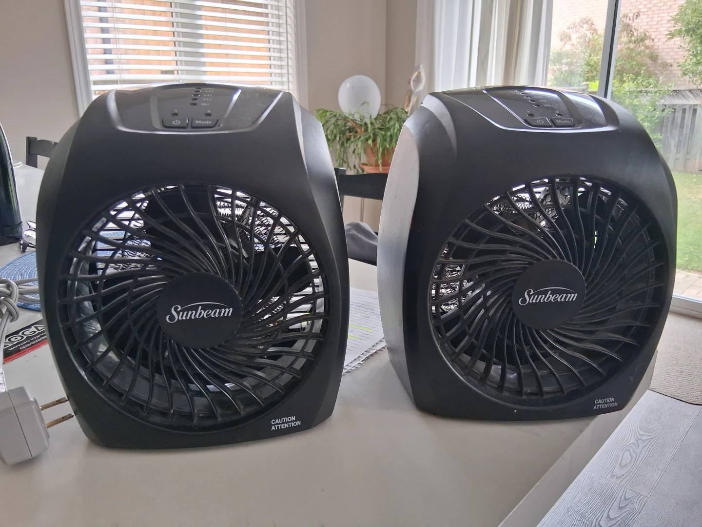 Two Sunbeam portable electric heaters