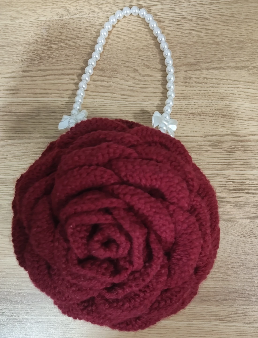 Crocheted rose handbag with pearl strap