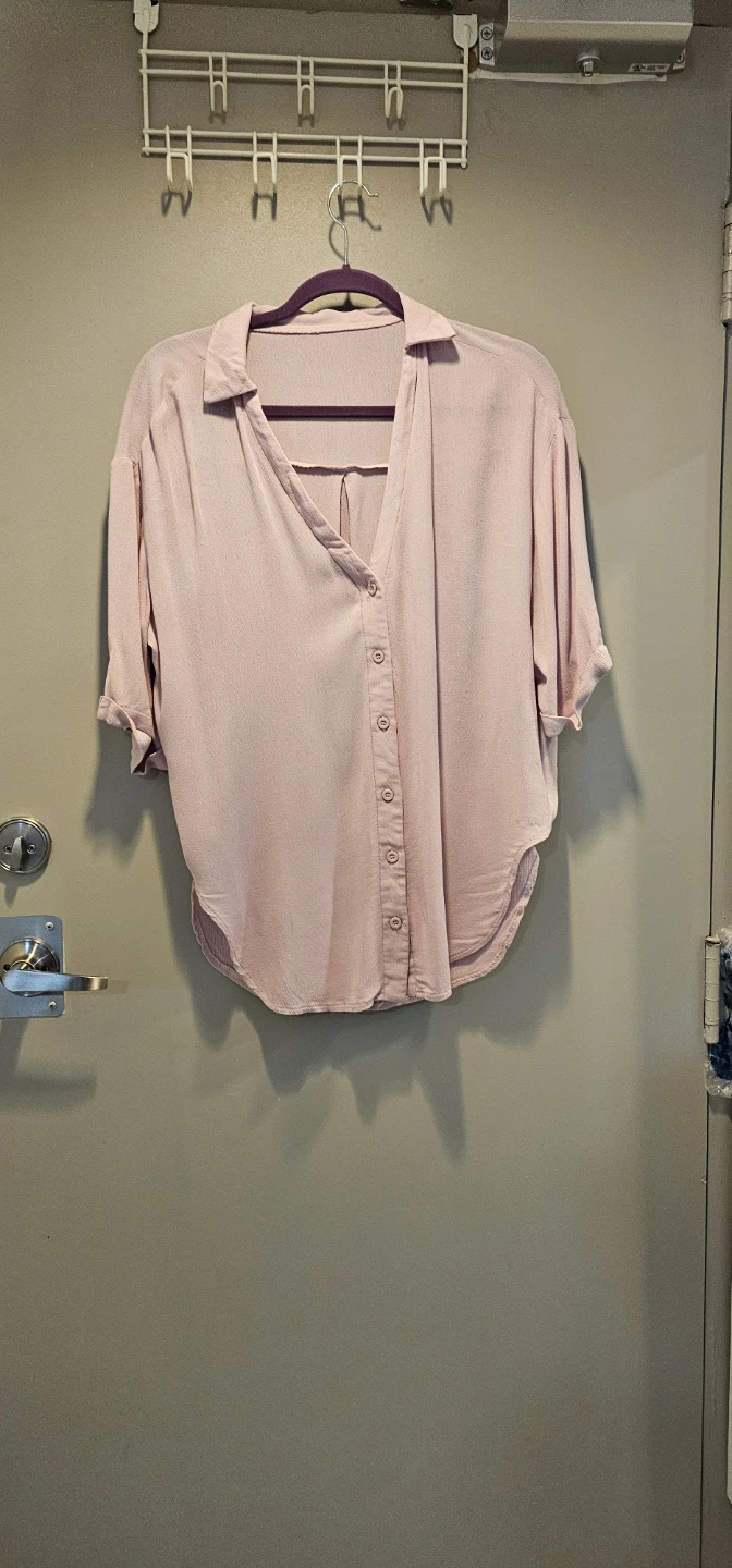Light pink button-down collared blouse