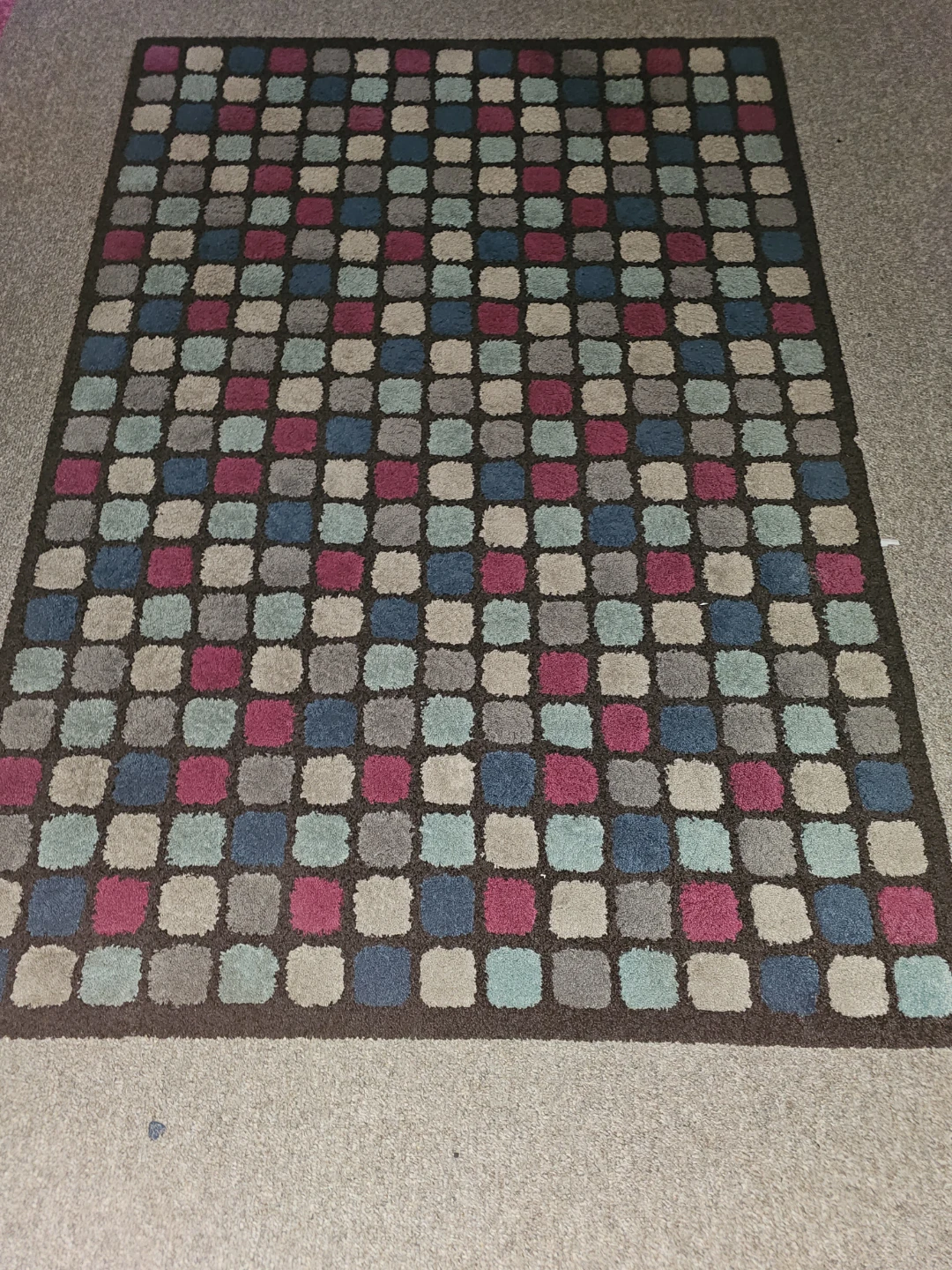 Multi-coloured check pattern area rug