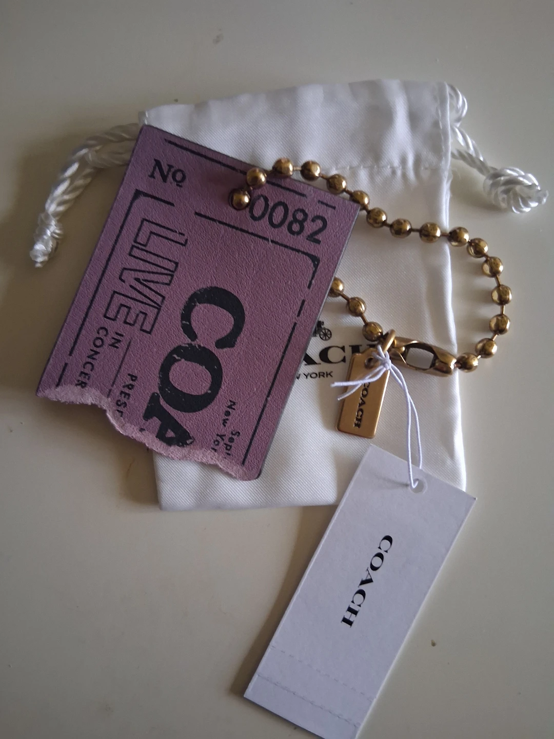 Coach ticket charm