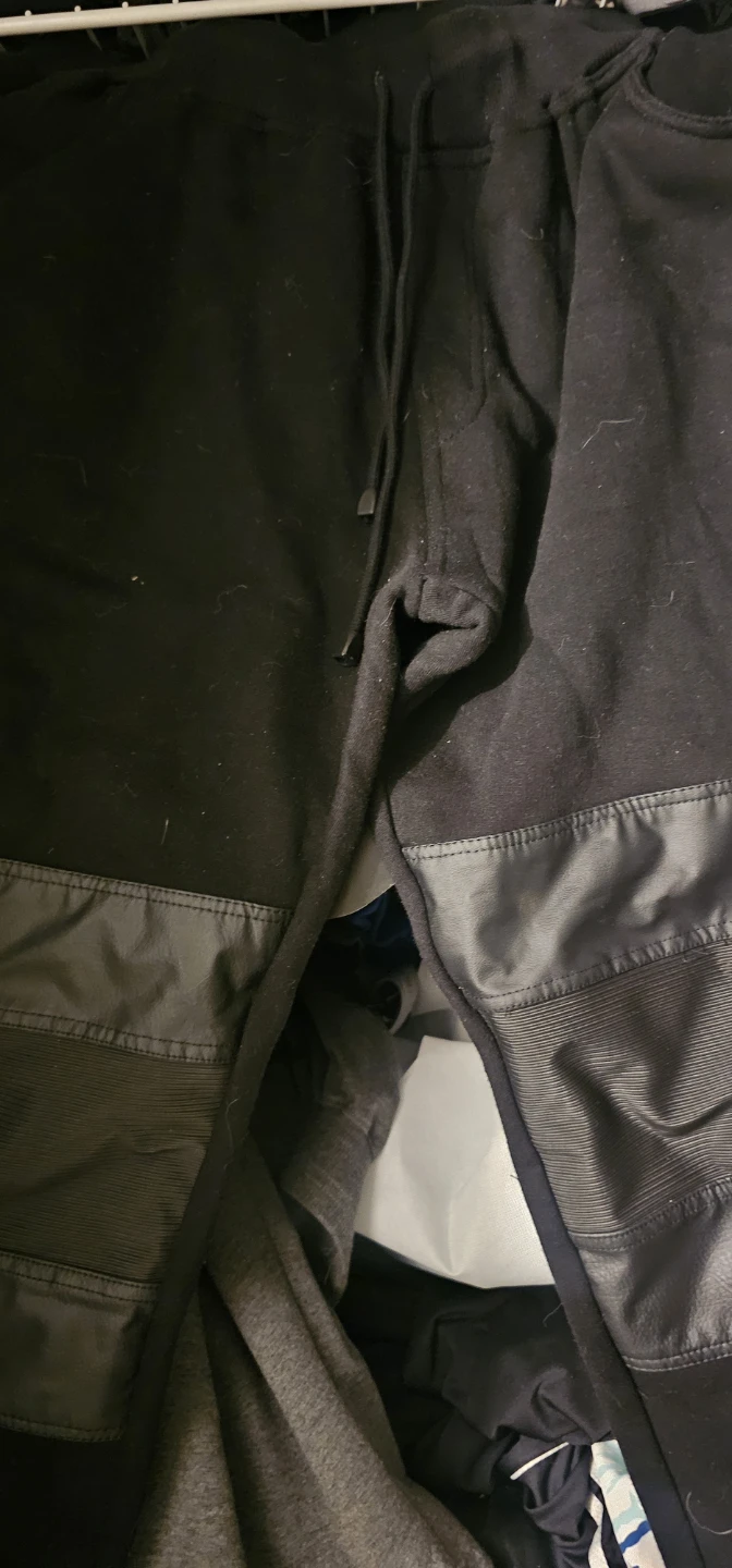 Black joggers with faux leather accents