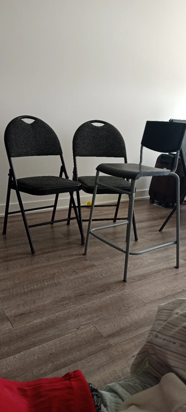 Two Black Padded Folding Chairs