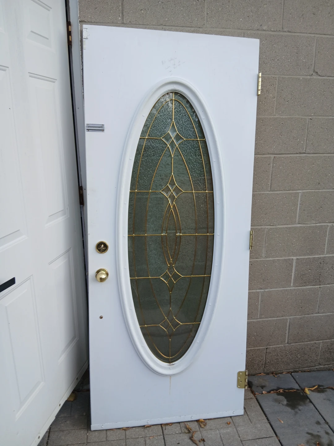 White exterior door with oval glass insert