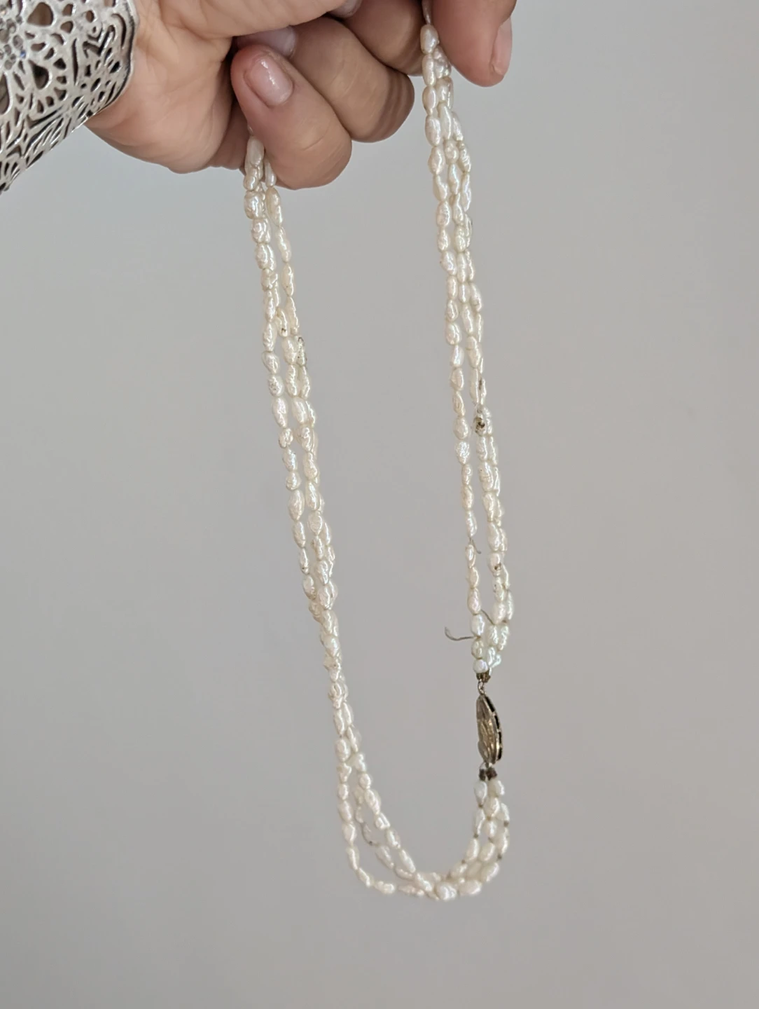 Three-strand freshwater pearl necklace with silver clasp