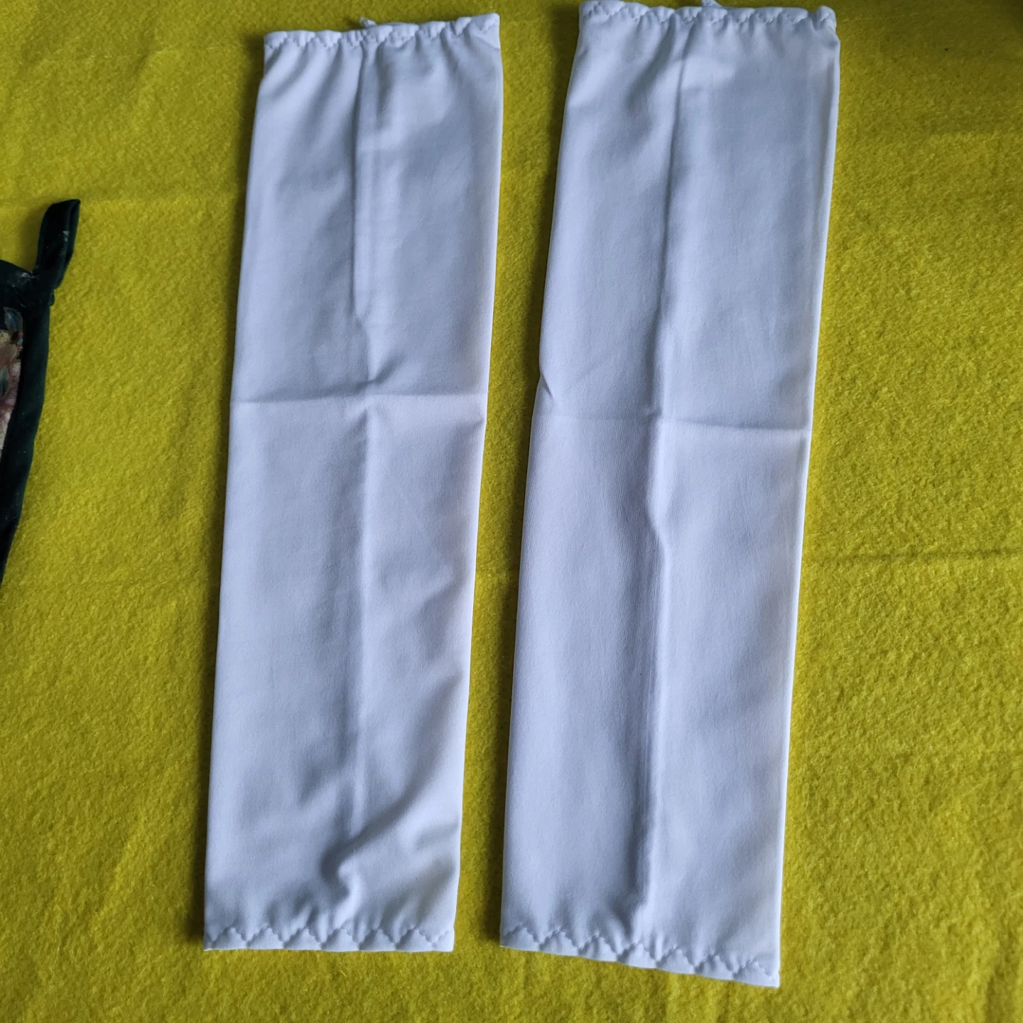 Pair of white cotton arm sleeves