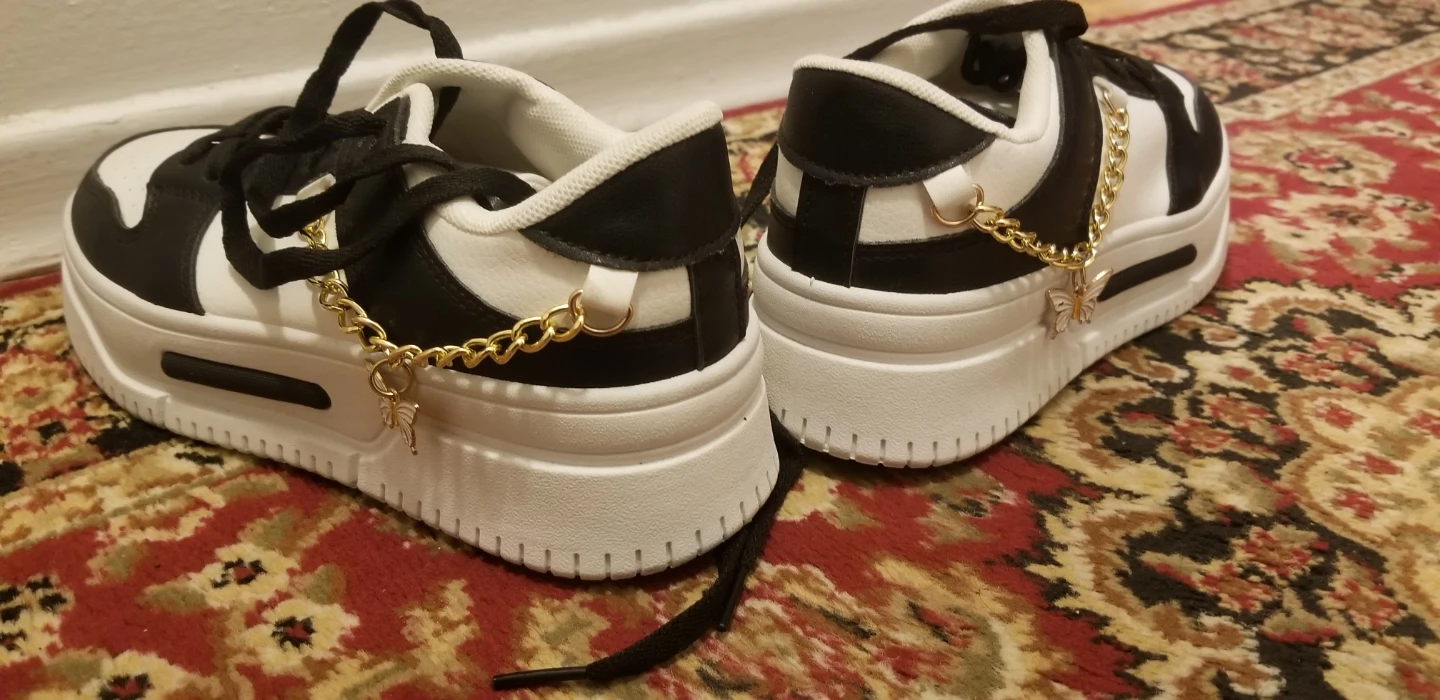 Black and white sneakers with butterfly chains - photo 3